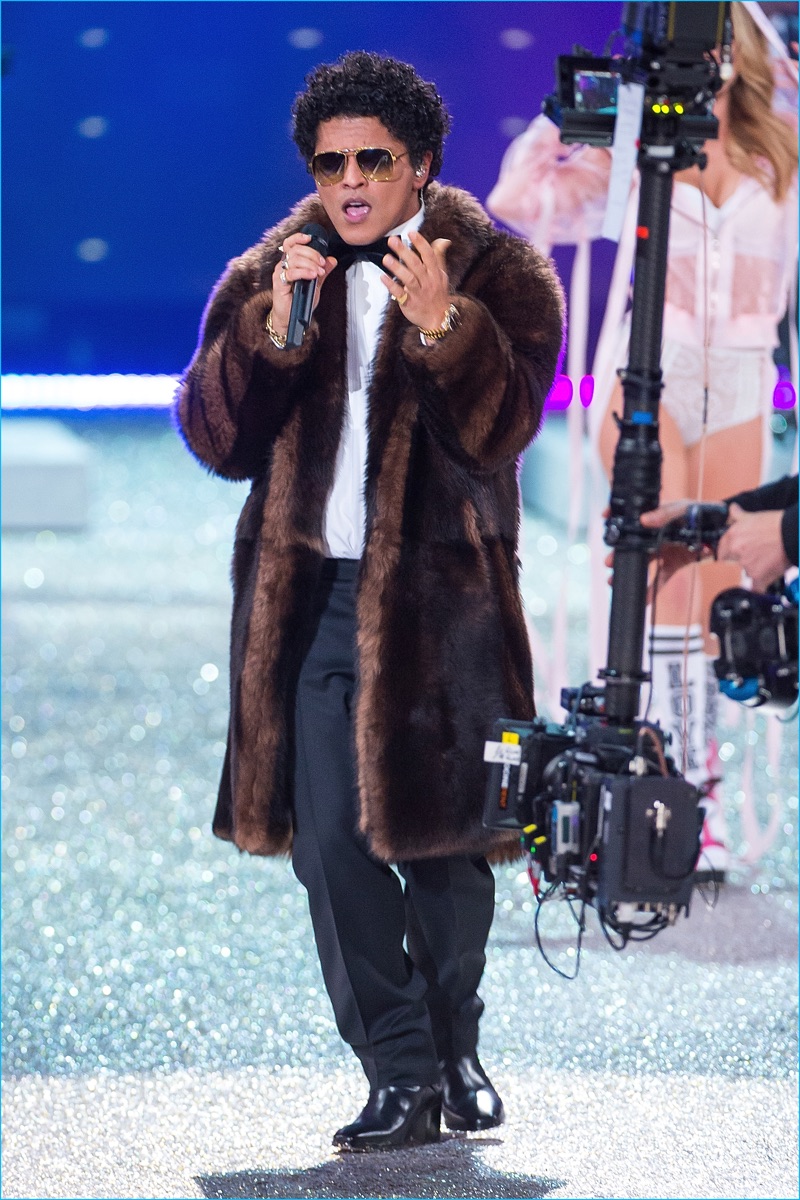 Singer Bruno Mars performs in a Tommy Hilfiger faux fur coat during the 2016 Victoria's Secret fashion show at Le Grand Palais in Paris.