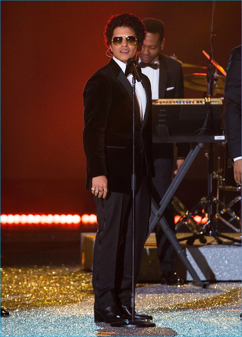 Bruno Mars takes to the runway to perform in a Tommy Hilfiger tuxedo for the 2016 Victoria's Secret fashion runway show.