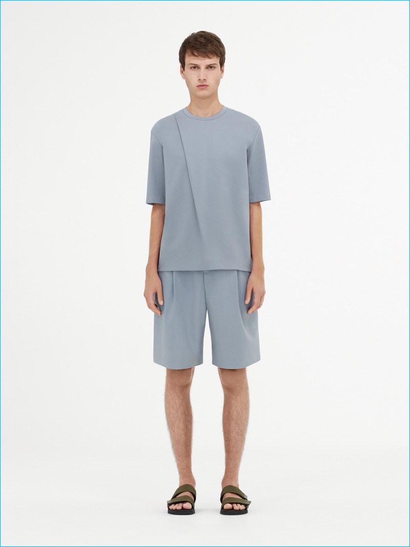 Slate blue dresses COS minimal pieces, which include oversized t-shirts and relaxed shorts.