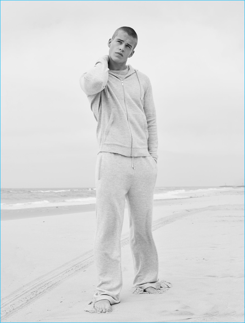 Taking to the beach, Mitchell Slaggert embraces a comfortable look from Calvin Klein Collection's pre-spring 2017 cashmere line.