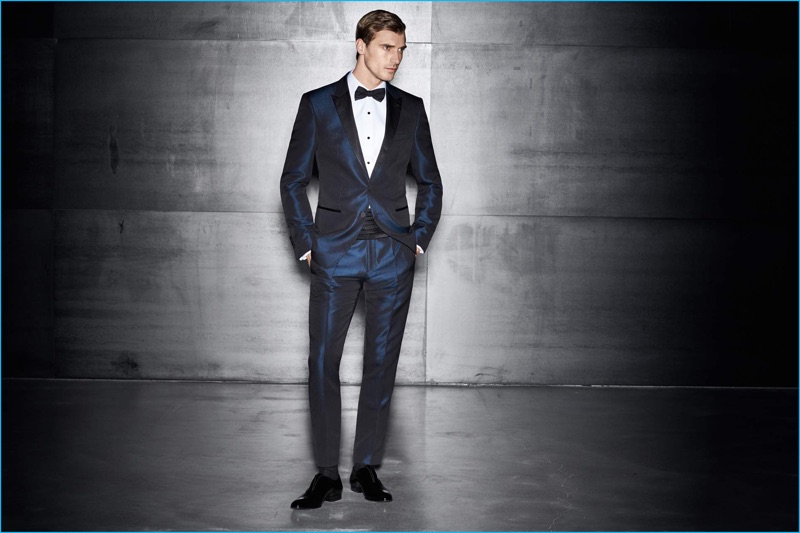 Clément Chabernaud is dashing in a midnight blue tuxedo from BOSS by Hugo Boss.
