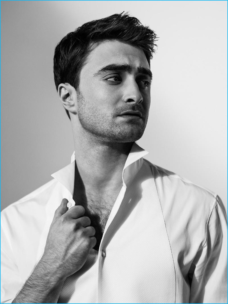 Embracing minimal style, Daniel Radcliffe wears a white shirt by Giorgio Armani.