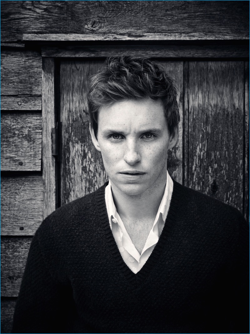 English actor Eddie Redmayne wears a v-neck sweater and smart shirt for Rhapsody magazine.