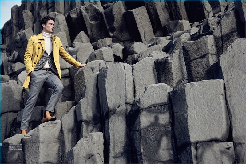 Canadian model Simon Nessman embraces a pop of color in a yellow BOSS Hugo Boss trench coat.