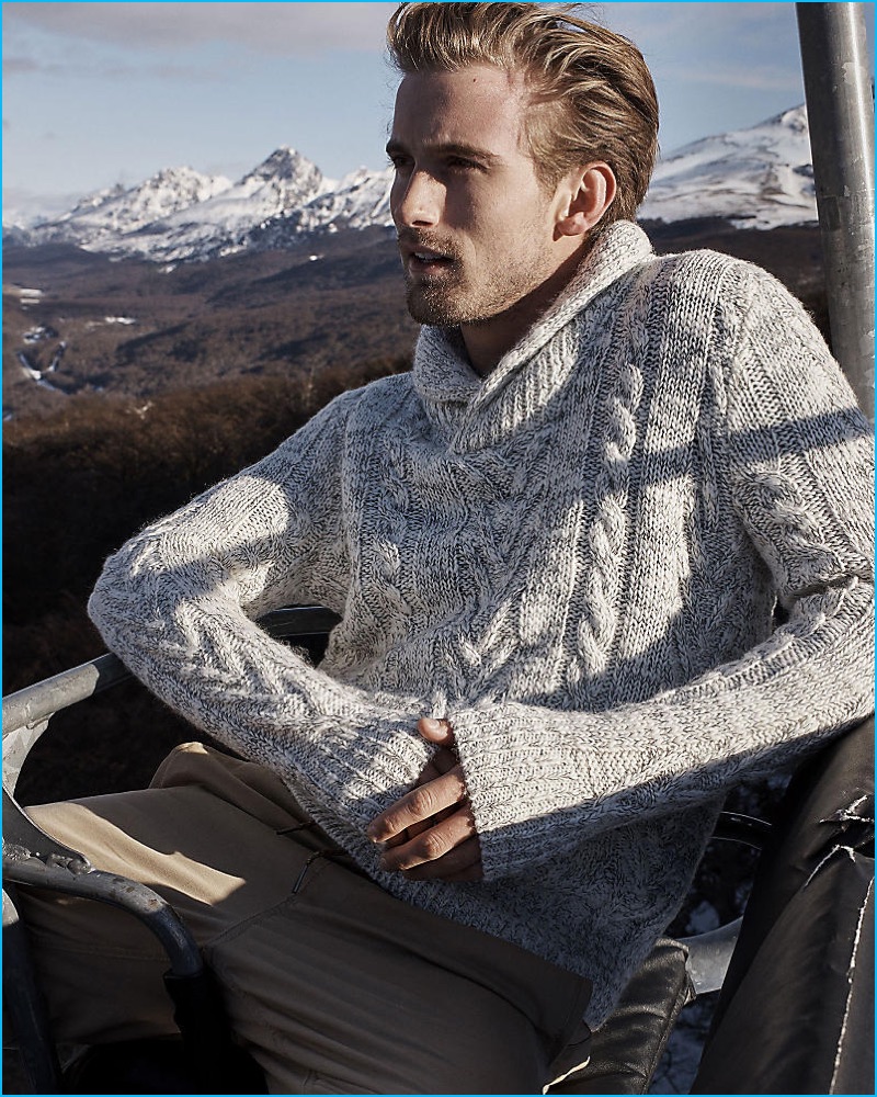 RJ King is winter chic in a cable-knit sweater from Express.