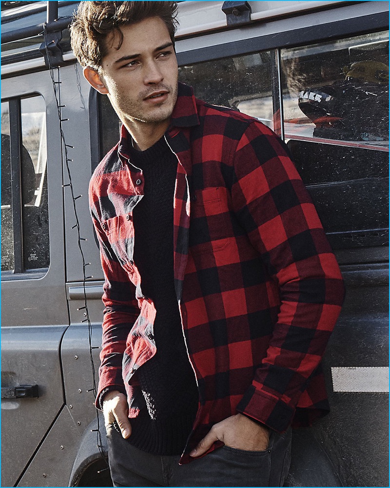 Brazilian model Francisco Lachowski rocks a red and black buffalo check flannel shirt from Express.