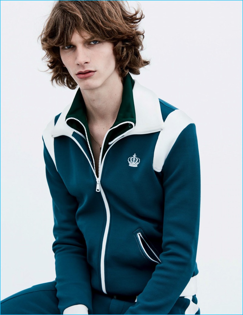 Erik van Gils is front and center in a Dolce & Gabbana track jacket and pants with a Burberry necklace.