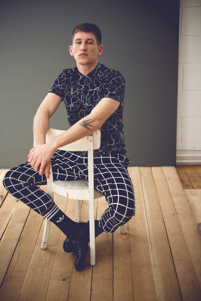 Mixing patterns, Jannik sports a black and white Topman shirt with Adidas socks, Zara Man's shoes. Jannik also sports pants from Vera Witthaut's personal collection.
