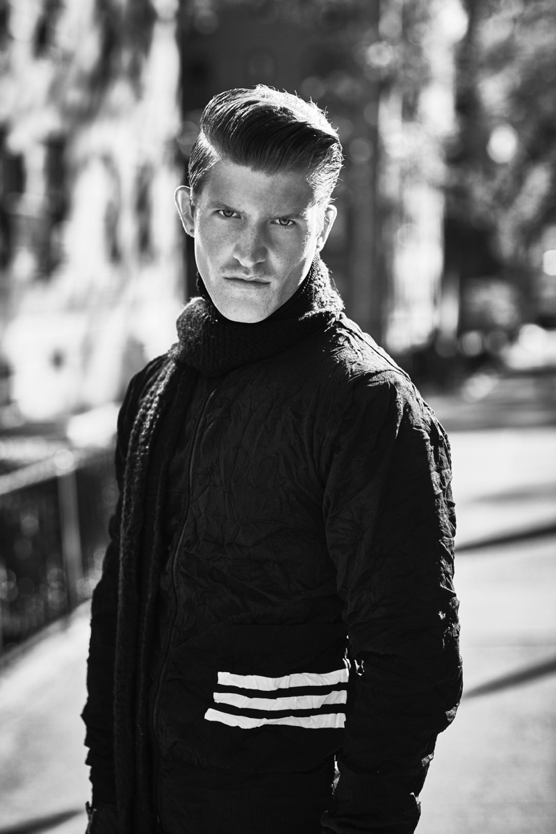 Appearing in a black and white image, Jamie Clarke wears a jacket by Y-3.