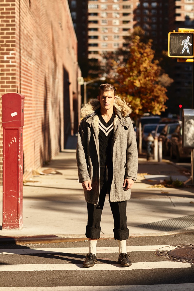 Stepping out into the streets of New York, Jamie Clarke wears a jacket and sweater from Polo Ralph Lauren. Jamie also sports Comme des Garçons trousers with Tricker's shoes.