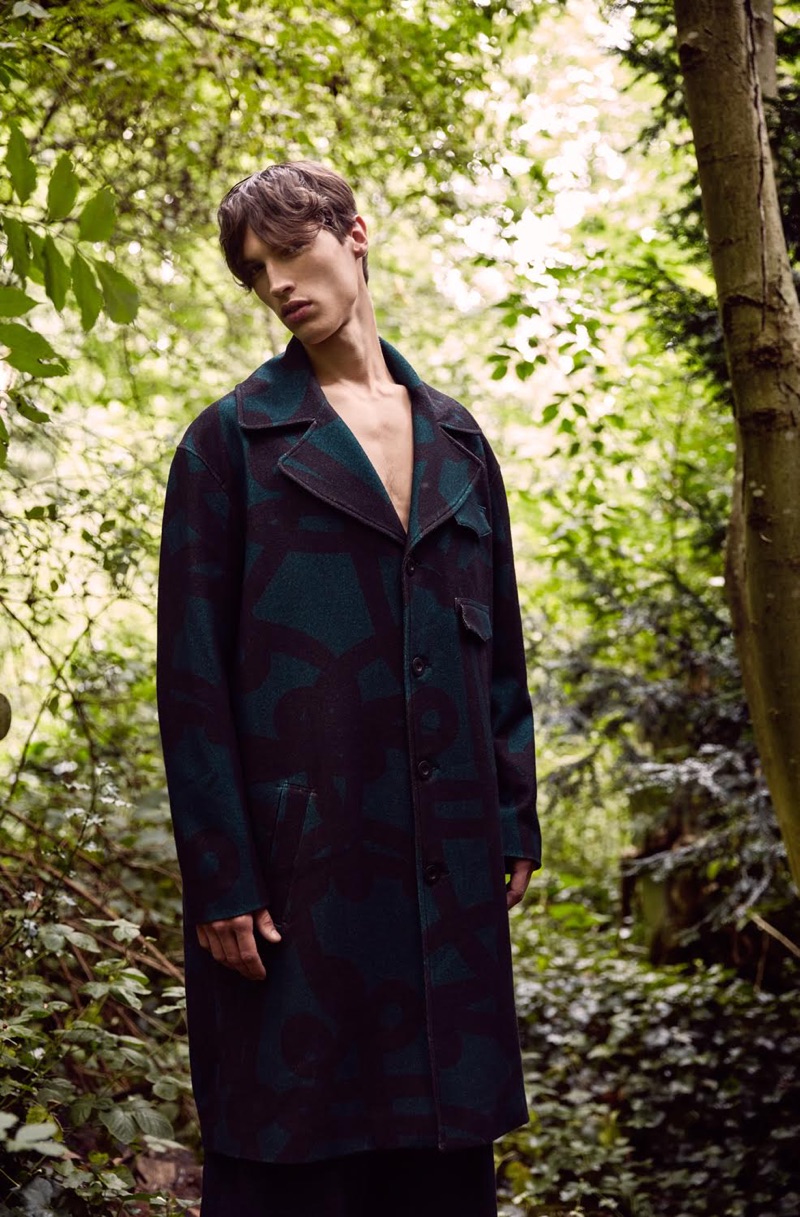 David Reiss photographs Nick in an oversized printed coat and trousers by Qasimi.