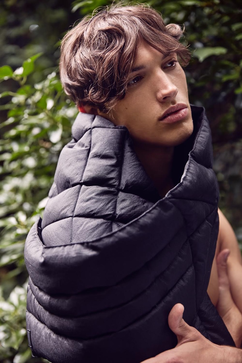 Bracing against the cold, Nick wraps up in an Emporio Armani scarf.