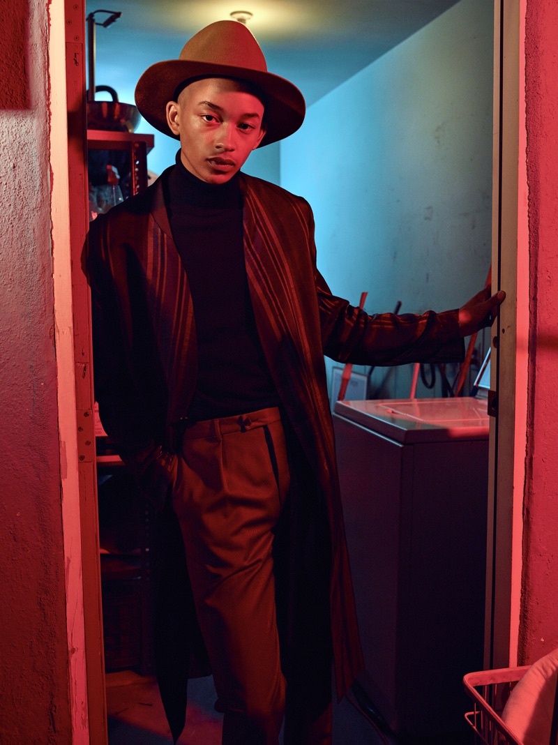 Embodying a cool image, Andre Lamone models a jacket by The Kooples with a Hugo Boss turtleneck, Jeffrey Rüdes pants, and a Gladys Tamez Millinery hat.