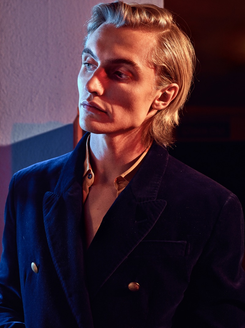 Model Hart Denton dons a double-breasted Jeffrey Rüdes blazer with a smart shirt.