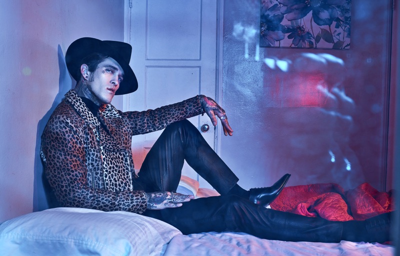 Rocking a rebellious look, Jimmy Q wears a Sav Noir leopard print jacket with an Ashton Michael Shirt and Gladys Tamez Millinery hat. The American model also models pants and shoes from The Kooples.