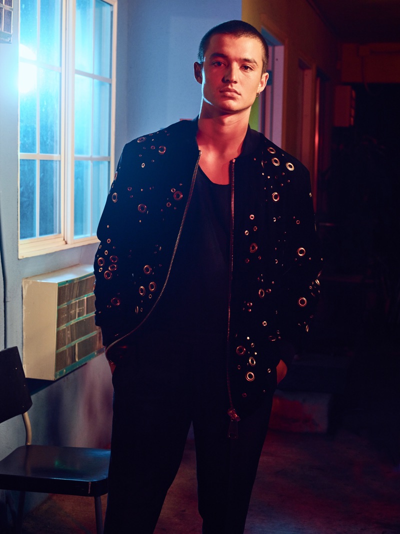 Kaleb Ressler tackles dark layers in an Ashton Michael bomber jacket with a tank and pants by The Kooples.