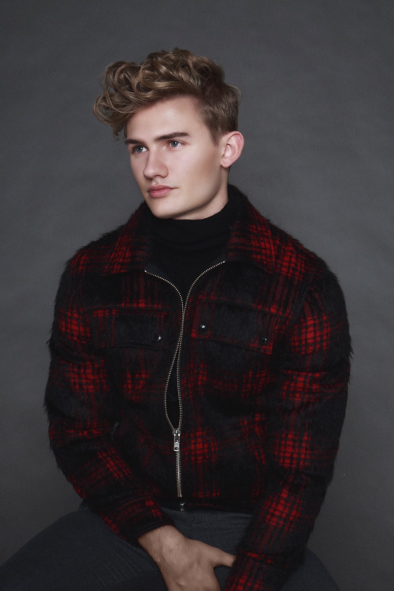 Tyler wears plaid jacket Maison Kitsune and sweater Jil Sander.