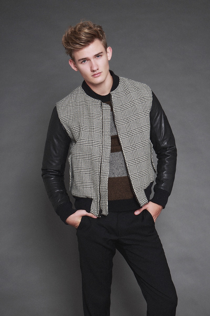 Tyler wears bomber jacket Rag & Bone, striped sweater Hugo Boss, and trousers J.Crew.