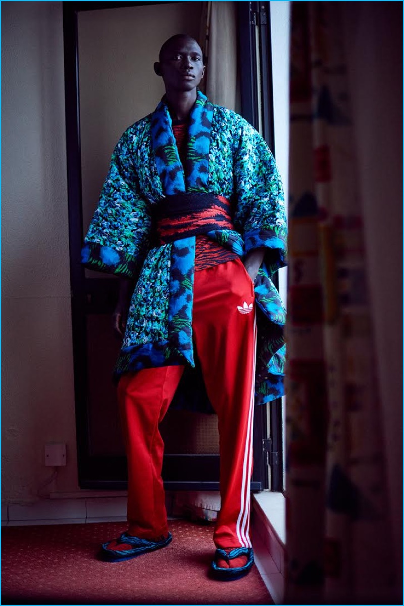 Leading model Fernando Cabral sports a Kenzo x H&M patterned robe with Adidas track pants.