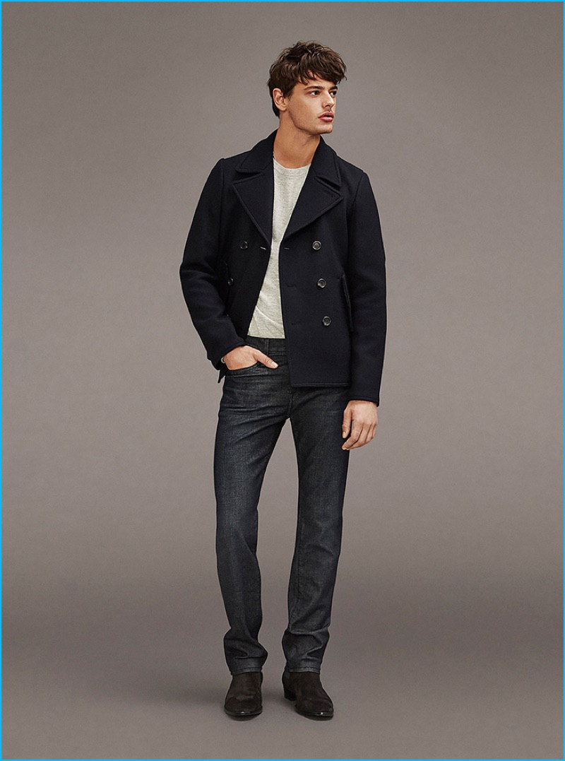 American model Jacob Morton sports a short peacoat with denim jeans from Frame Denim.