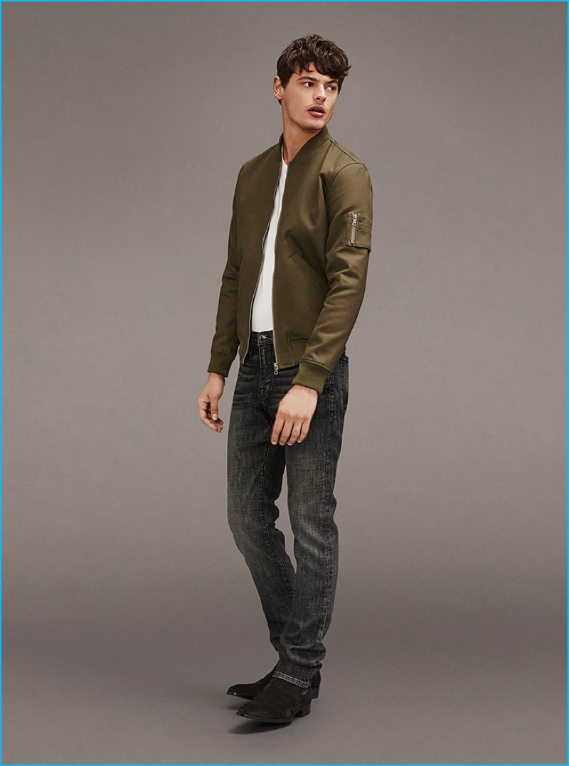 Going casual, Jacob Morton dons a bomber jacket with a tee and distressed denim jeans from Frame Denim.