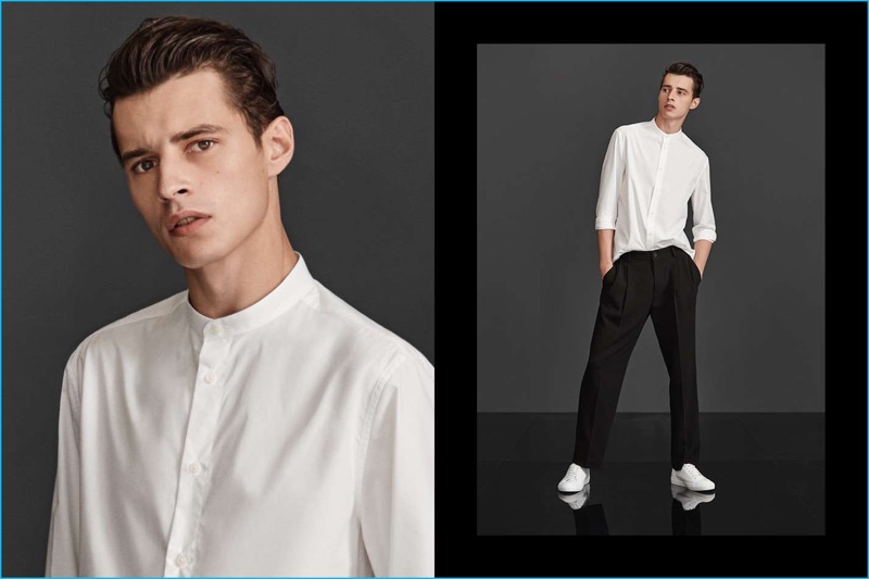 Embracing a smart H&M look, Adrien Sahores models wide-leg suit pants with a grandad collar shirt and white sneakers.