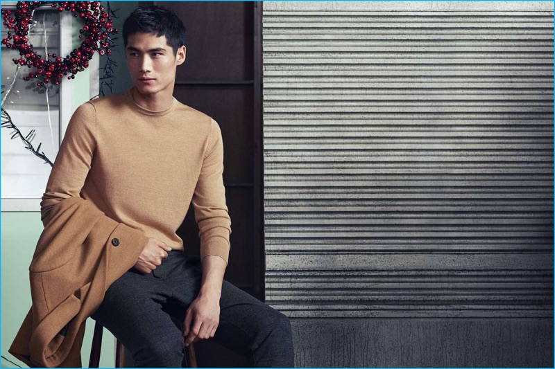 Hao Yun Xiang sports a merino blend sweater with smart trousers by H&M.