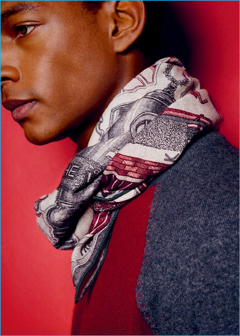 Ready for his close-up, Ty Ogunkoya wears a patterned scarf by French fashion house, Hermès.