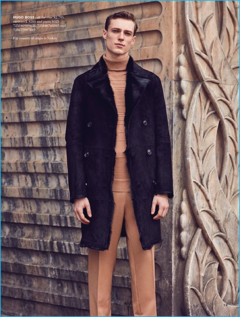 Standing tall, Tommaso de Benedictis dons a brown and black look by Hugo Boss.