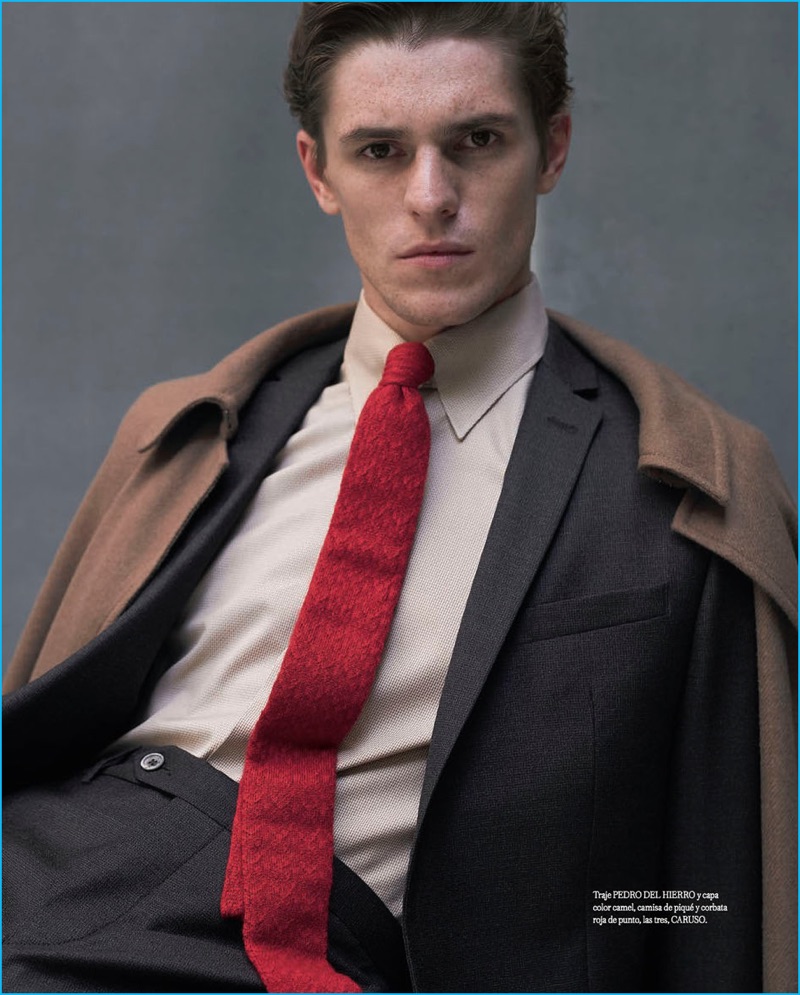 Pablo Zamora photographs Adrien Dantou in a Pedro del Hierro suit with a cape, shirt, and tie from Caruso.