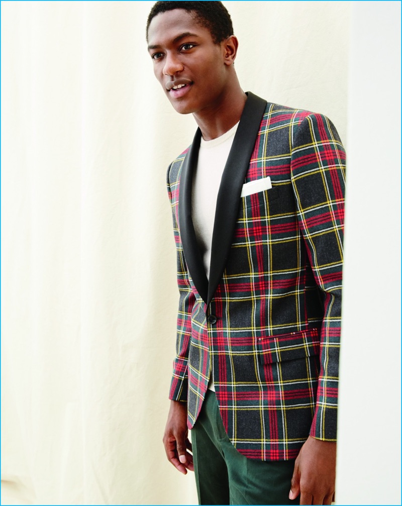 Hamid Onifade models a Ludlow shawl collar plaid print tuxedo jacket from J.Crew.