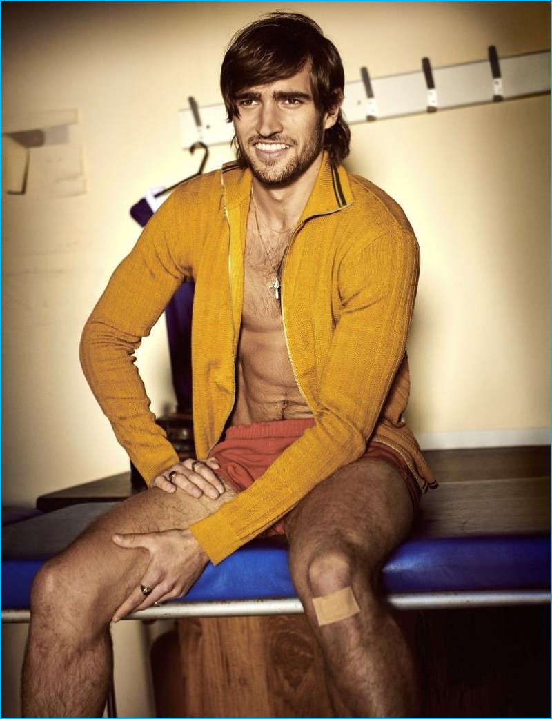 All smiles, Jack Tyerman sports a yellow Coach cardigan with vintage Carlo Manzi shorts.