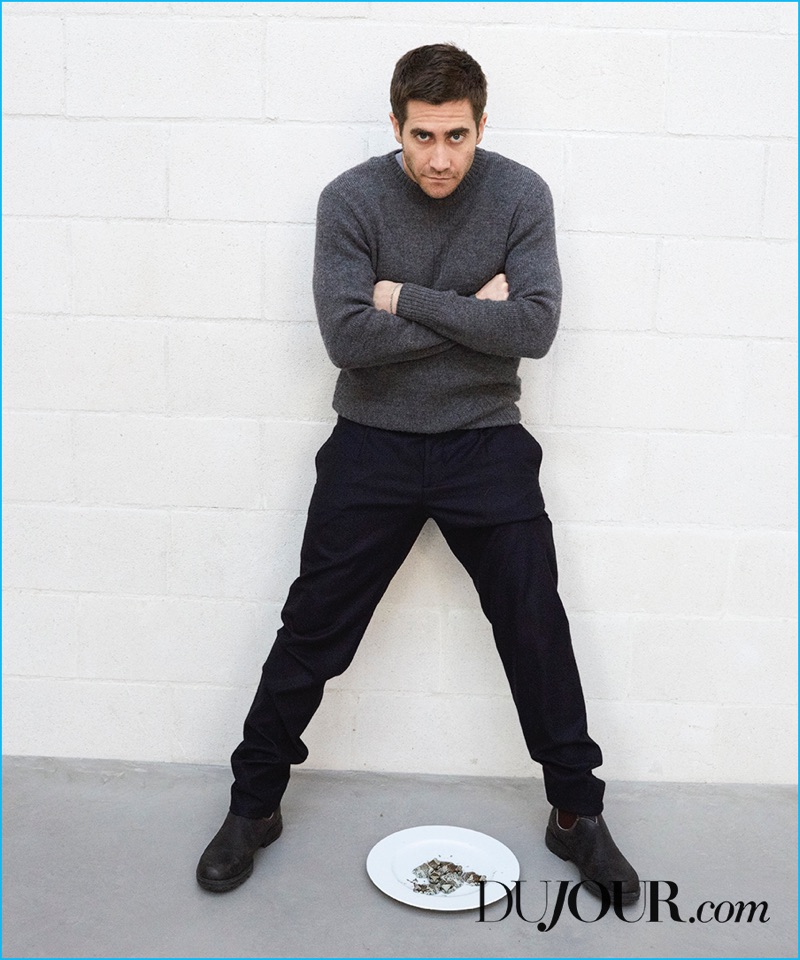 Crossing his arms, Jake Gyllenhaal wears a Margaret Howell sweater with Hermes trousers, and Blundstone boots.