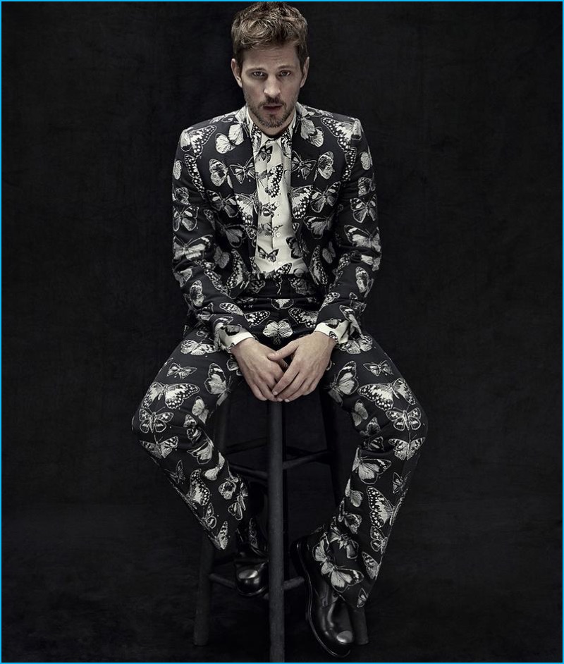 Suiting up with Neiman Marcus, Kelly Rippy wears a butterfly print shirt and suit by Alexander McQueen.