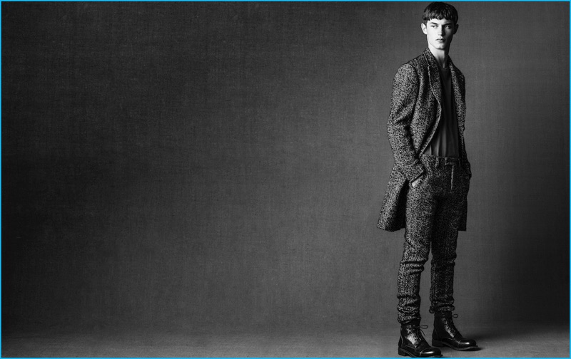 Hitting the studio, Kit Butler wears a Valentino t-shirt with a suit and boots by John Varvatos.