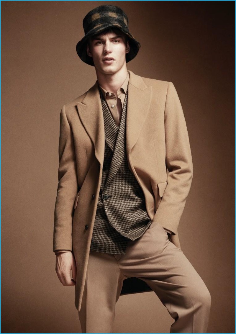 Appearing in a Wool editorial, Kit Butler sports a Paul Smith shirt, wool jacket, and trousers. Kit also wears a Maison Michel wool hat.