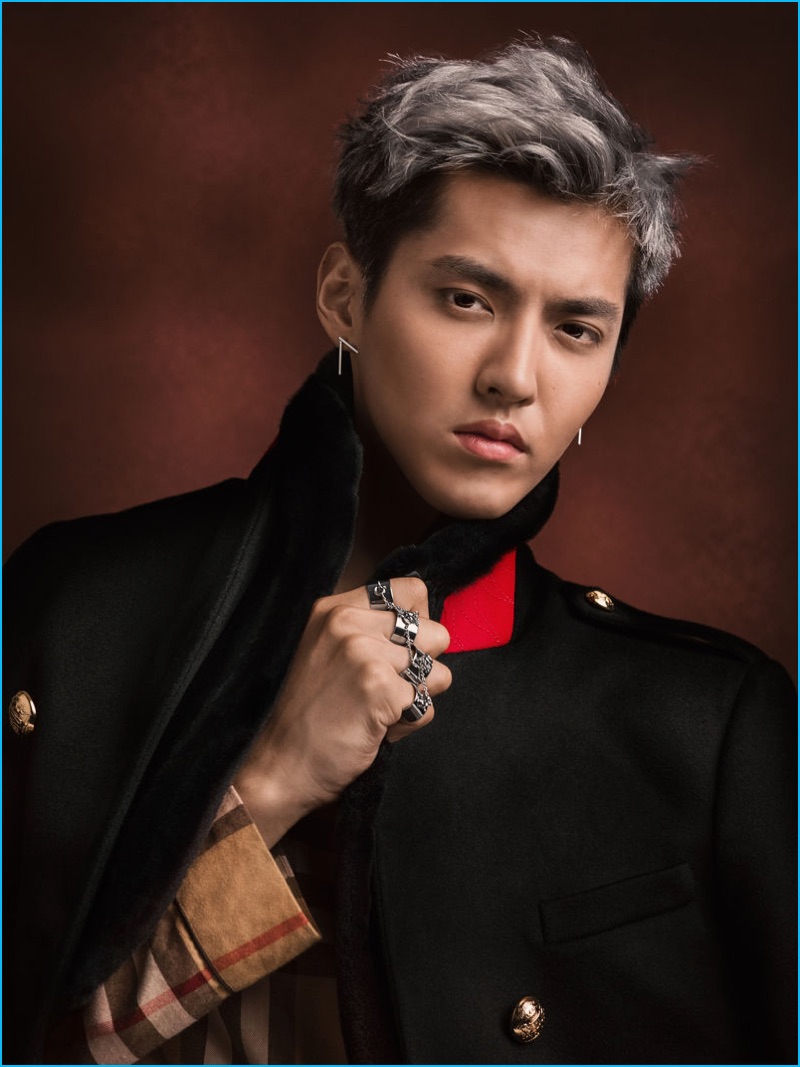Connecting with Burberry, Kris Wu dons a regimental cashmere coat and check flannel pajama-style shirt.