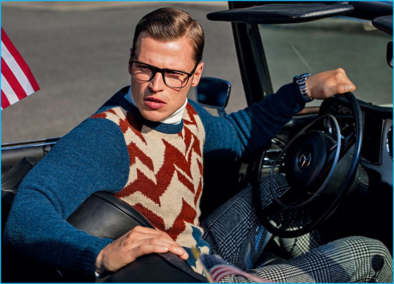 Lars Burmeister wears a chevron print sweater by Salvatore Ferragamo.