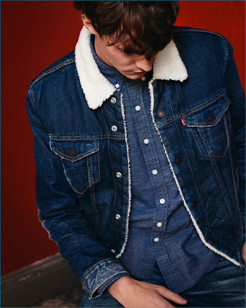 Model Matthew Hitt sports a sherpa denim trucker jacket by Levi's.