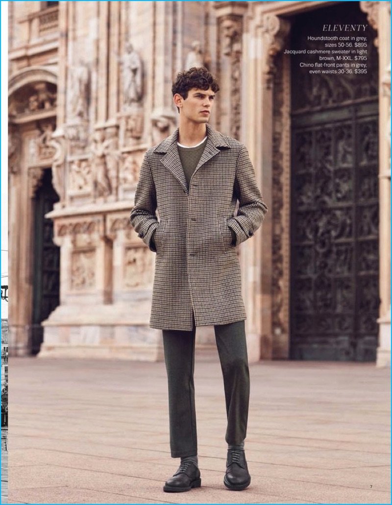French model Arthur Gosse steps out in slim trousers and a check single-breasted coat by Eleventy.
