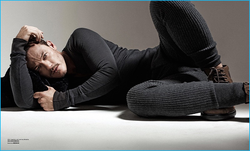 Appearing in a photo shoot for Essential Homme, Luke Evans dons a Dolce & Gabbana look with brown Grenson boots.