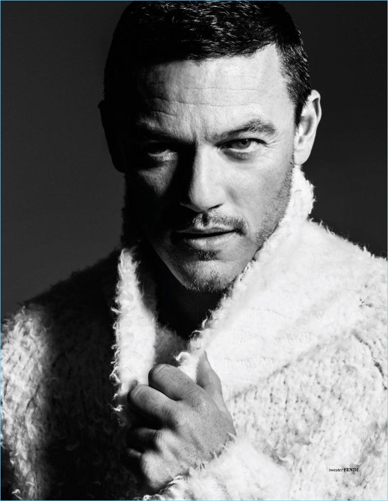 Luke Evans wears a turtleneck sweater by Fendi.