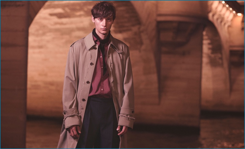 Thomas Cooksey photographs Timur Simakov in a Maison Margiela trench coat with a Massimo Alba shirt, Haider Ackermann turtleneck, and Raf Simons trousers.
