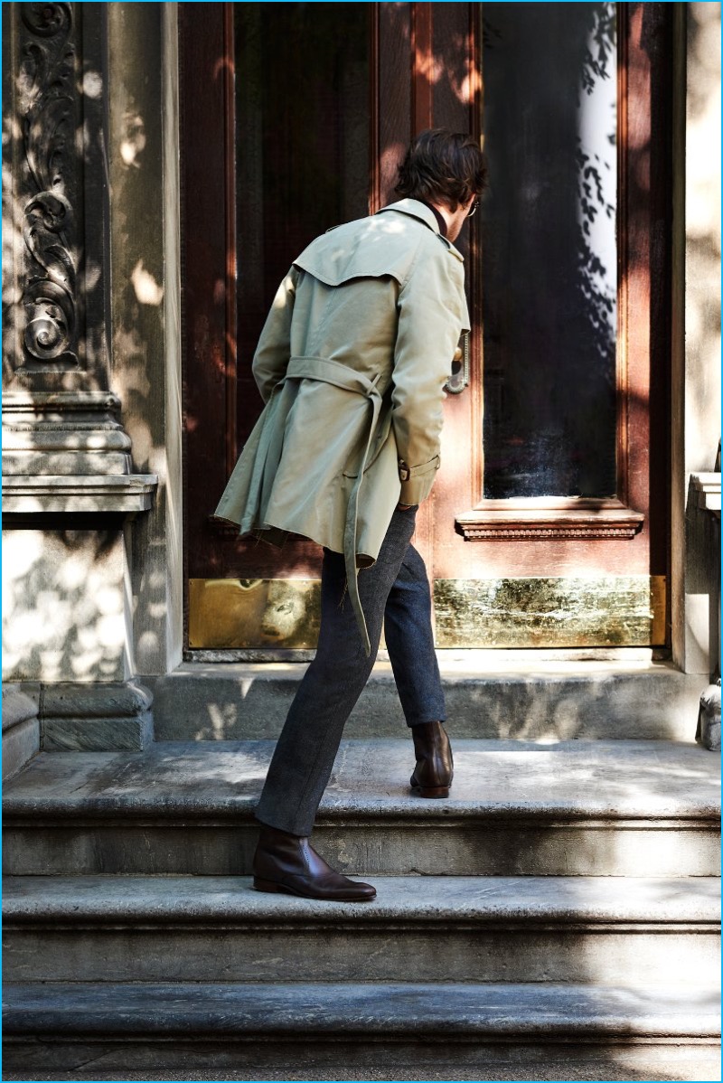 Venturing outdoors, Matt Smith wears an Alexander McQueen trench coat and Gucci leather Chelsea boots with an Ermenegildo Zegna suit and turtleneck sweater.