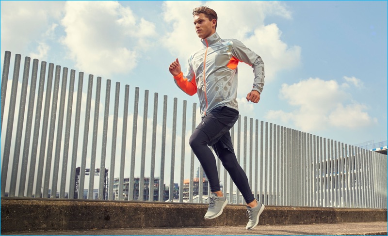 Going on a run, Zachary Grenenger wears a performance jacket from Adidas by Kolor with Casall performance shorts. Zachary also sports A.P.C. x Outdoor Voices leggings and Brandblack sneakers.