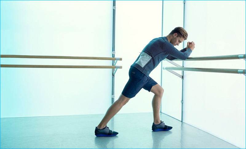 Australian model Zachary Grenenger dons a Satisfy jersey t-shirt, A.P.C. x Outdoor Voices performance shorts, and Balenciaga sneakers.