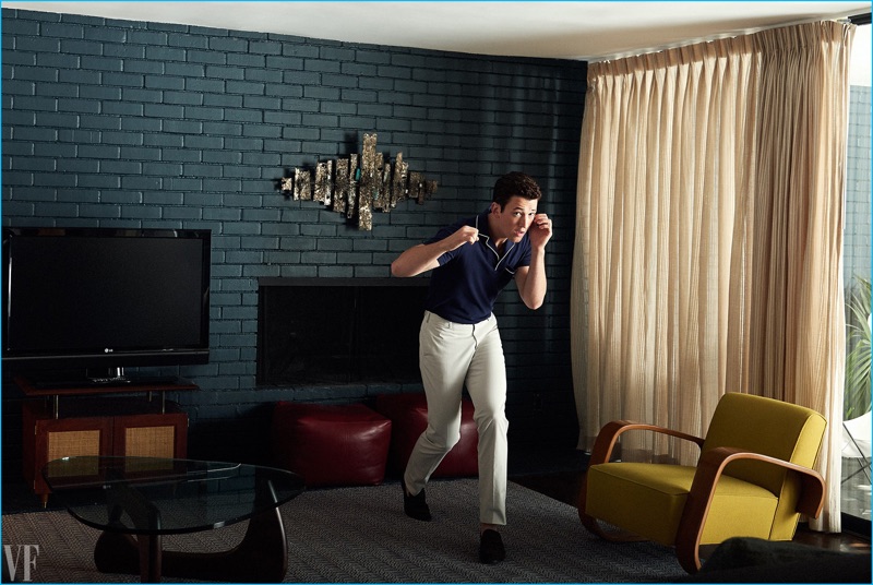 Taking a fighting stance, Miles Teller sports a Orlebar Brown polo shirt with Incotex trousers and Tod's shoes.