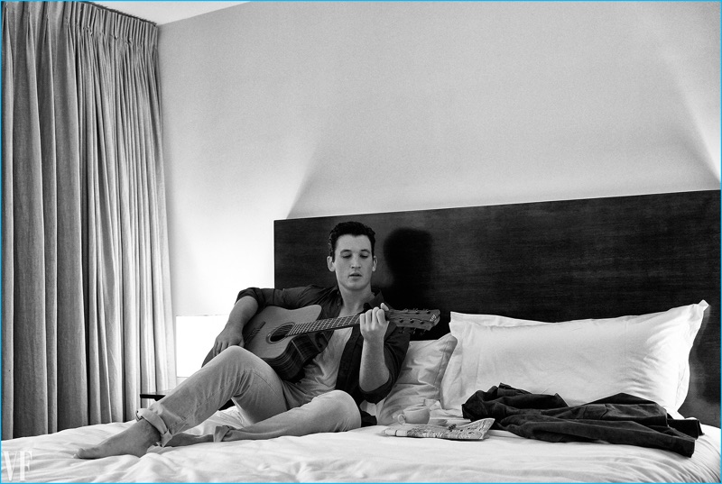 Playing the guitar, Miles Teller wears a Bottega Veneta shirt and Calvin Klein tank with Incotex trousers. » Miles Teller Links Up with Vanity Fair, Talks Bad Movies Playing the guitar, Miles Teller wears a Bottega Veneta shirt and Calvin Klein tank with Incotex trousers.