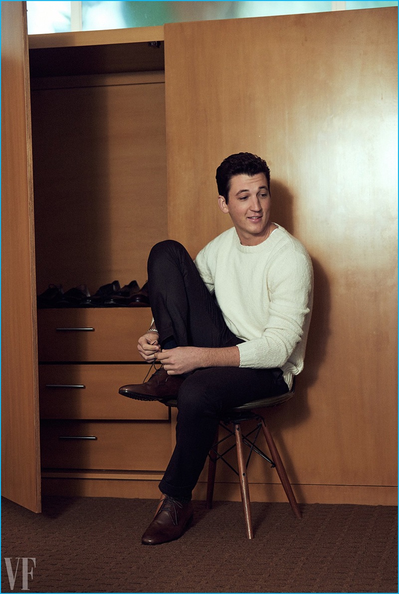 Miles Teller wears an A.P.C. sweater with Ermenegildo Zegna trousers and Tod's leather dress shoes.