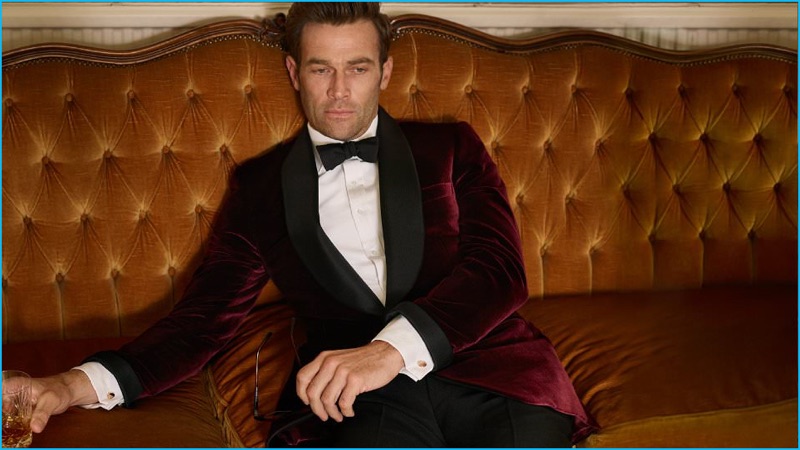 Formal is the name as Kingsman executes a classic burgundy velvet tuxedo jacket with black tuxedo trousers. A Drake's silk bow-tie, Deakin & Francis cufflinks, and a Turnbull & Asser shirt round out the formal ensemble.